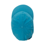 A blue cap sits upright displaying its round top and extended brim against a plain background emphasizing its color and shape. The setting is simple and devoid of distractions.