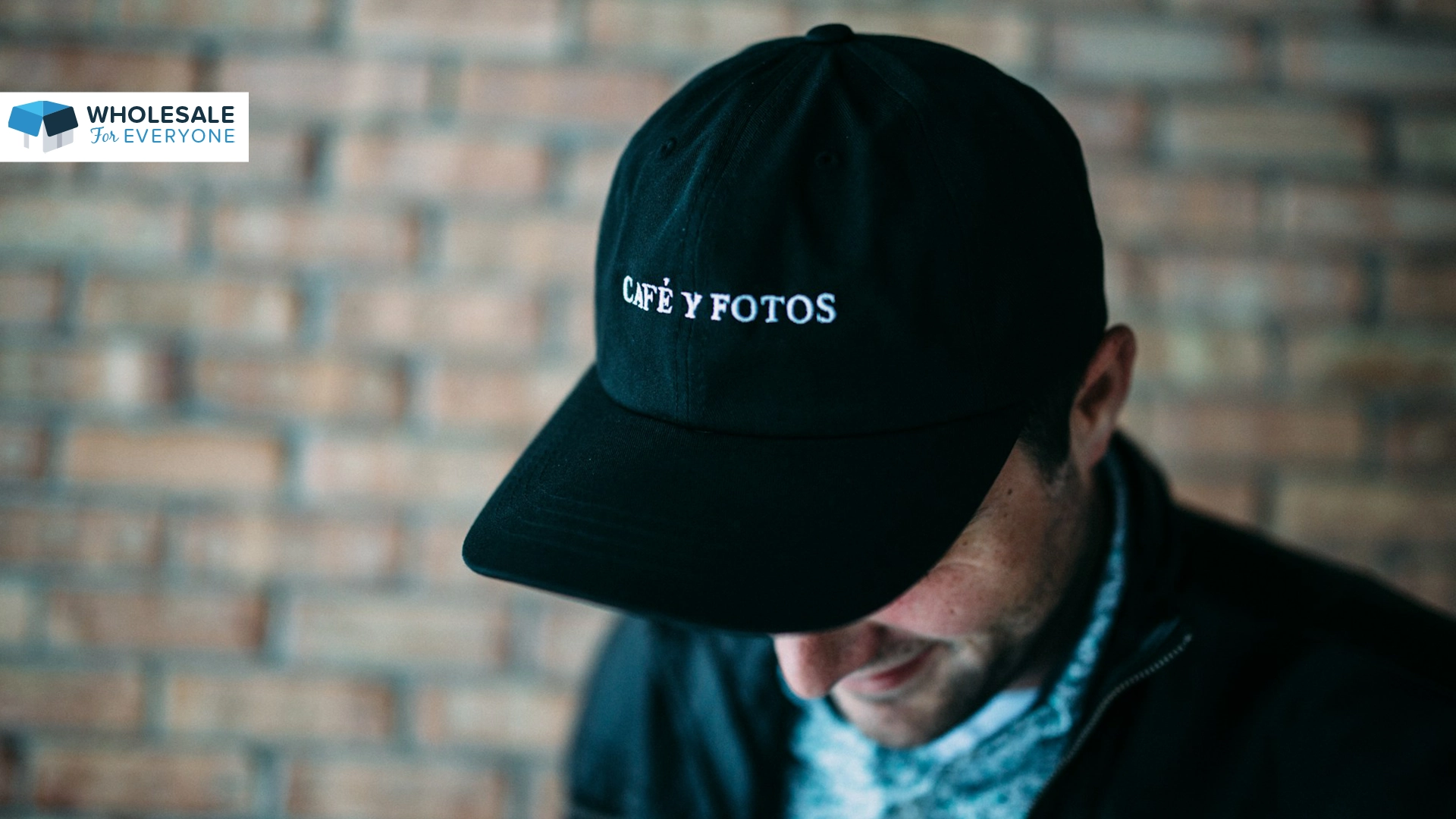 The photo shows a top view of a man wearing a dad hat.