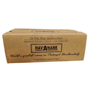 A cardboard box labeled Hav-A-Hank contains 24 individually packaged handkerchiefs. The box emphasizes its reputation as the world's greatest name in packaged handkerchiefs and notes it is sold coast to coast.