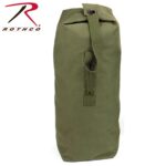 A green canvas duffel bag stands upright featuring a top closure with a single strap and a button for securing the opening suggesting it is designed for outdoor or travel use.