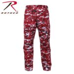 Red camouflage cargo pants with a pixelated pattern are displayed upright. They feature pockets and a waistband  suitable for outdoor activities or casual wear. The brand logo ROTHCO is visible in the top left corner.