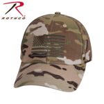 A camouflage baseball cap features an embroidered American flag design. The cap is positioned with the brim facing downward against a neutral background. The brand name Rothco is displayed in the top left corner.