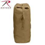 A cylindrical tan duffel bag stands upright featuring a top closure and a handle for carrying suitable for storage and travel in various environments. The logo Rothco is visible on the side.