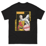 A black t-shirt features an illustration of a bald superhero in a yellow suit and white cape with a clenched fist emphasizing strength surrounded by stylized text in Japanese and English.
