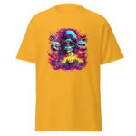 A yellow t-shirt features a vibrant graphic design of a skull with long hair and sunglasses surrounded by colorful flames and skulls in a chaotic scene  creating a bold visual statement.