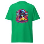 A bright green t-shirt features a colorful graphic of a skull wearing sunglasses and a helmet surrounded by vibrant flames and cartoonish skulls against a fantastical backdrop.