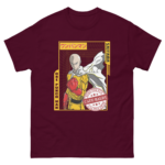 A t-shirt features a character with a bald head wearing a yellow jumpsuit and a white cape standing confidently with a fist clenched the design includes Japanese text and a badge that reads HERO FOR FUN CAPE BALDY.