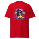 A red t-shirt displays a vibrant graphic featuring a skull with sunglasses and long hair  flanked by two smaller skulls  set against a colorful  fiery background.