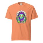 An orange t-shirt features a graphic of an alien holding cannabis leaves and wearing a colorful hat with the word WEED prominently displayed below the alien.