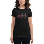A black t-shirt displays two stick figures holding hands each with a heart on their chest beside the text TRUE LOVE in red. The wearer stands in a neutral setting.