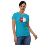 A woman wearing a bright teal t-shirt stands smiling the shirt features a graphic of two cartoon characters in red and white with the text FOREVER MINE beneath them