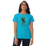 A woman stands wearing a bright blue t-shirt featuring a green silhouette of a woman in a hat with shamrocks and the text "Lucky Woman" in a playful font.