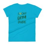 A turquoise t-shirt features the text "LUCKY LITTLE DUDE" in playful fonts with a horse shoe icon and decorative sparkles  suggesting a casual  fun  and colorful design suitable for children.
