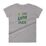 A gray t-shirt features bold text reading "LUCKY LITTLE DUDE" in green with a yellow horseshoe above and sparkling accents  suggesting a fun  casual style suitable for children.