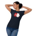 A woman in a black t-shirt is smiling and stretching her arms above her head. The shirt features a playful graphic of red and white characters with the text "FOREVER MINE" below.