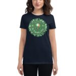 A person wears a navy t-shirt featuring a green circular design with clovers and the text "HAPPY St. Patrick's Day" with a hat and glasses illustration  celebrating a festive occasion.