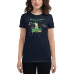 A dark navy t-shirt features a colorful illustration of a leprechaun with a sign reading St. Patrick's Day surrounded by festive decorations like shamrocks and stars.