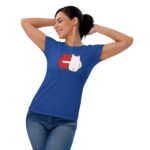 A woman wearing a blue t-shirt with a red and white graphic design is stretching and smiling  with her hands behind her head  in a casual and playful pose. The text "FOREVER MINE" is below the graphic.