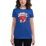 A woman wears a blue t-shirt featuring a red heart character wearing headphones and boxing gloves with the text "LOVELY PERSON" above it against a simple background.