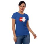 A woman wearing a blue t-shirt with a graphic design of two figures  one red and one white  is standing and smiling. The text reads "FOREVER MINE."