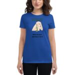 A woman wearing a blue t-shirt holds a green wine bottle while leaning slightly. The shirt features text that reads HAPPY ST. PATRICK and Wine because adulting is hard.