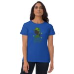 A woman wears a blue t-shirt featuring a green silhouette with a hat and shamrock designs alongside the text "Lucky Woman " set against a neutral background.