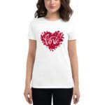 A woman wears a white t-shirt featuring a red heart made of rose petals with the word love styled in an elegant font displayed prominently on the shirt.