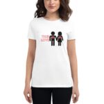 A woman is wearing a white t-shirt featuring two stick figures holding hands with red hearts on their chests and the text TRUE LOVE above them  conveying a romantic message.