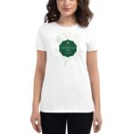 A woman is wearing a white t-shirt featuring a green decorative element with the text Life's like a cup of tea surrounded by simple leaf and flower illustrations.