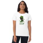 A woman wearing a white t-shirt stands confidently displaying a graphic of a woman's silhouette in green with a hat and the text Lucky Woman surrounded by shamrocks.