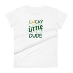 A white t-shirt features green and gold text that says LUCKY LITTLE DUDE with decorative sparkles and a horseshoe accent symbolizing luck in a casual apparel setting.