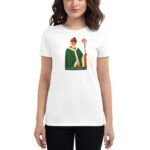 A woman wears a white t-shirt featuring a graphic of Saint Patrick  holding a staff  set against a plain background  celebrating Irish culture or a holiday.