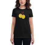 A person is wearing a black t-shirt featuring two cartoonish smiling yellow olives with a caption saying OLIVE YOU in pink text  against a simple background.