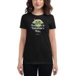 A woman wears a black t-shirt featuring the text "Everyday is Valentine's Day" with a floral design. She stands in a neutral setting with a focus on the shirt's message.