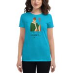 A woman wearing a bright blue t-shirt displays an illustration of a bearded figure in green robes holding a staff with text below reading LUCKY surrounded by small clovers