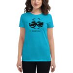 A person wears a bright blue t-shirt featuring a smiling face with sunglasses and the text LUCKY DAY below. The setting appears casual and cheerful.