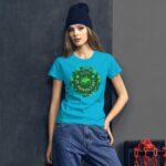 A young woman poses in a bright blue St. Patrick's Day t-shirt featuring a green design and the text "HAPPY ST PATRICK'S DAY" with a wreath of shamrocks against a dark backdrop.