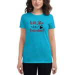 A woman wears a bright blue t-shirt featuring the text "Will You Be My Valentine?" in red and black. The setting suggests a casual or festive occasion.