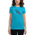 A turquoise t-shirt features the phrase love you in a stylish font along with two red hearts and a red lipstick kiss mark displayed on the front against a white background.