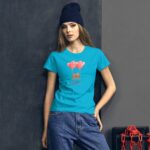 A young woman stands against a dark wall wearing a bright blue t-shirt featuring two cartoon bears holding pink heart-shaped balloons with the word LOVE below the design.