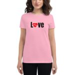 A pink t-shirt features the word Love in black with a red heart symbol. A person wearing the shirt stands in a neutral setting  showcasing casual attire.