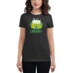 A woman is wearing a dark-colored t-shirt featuring two frothy beer mugs with a splash. The text reads CHEERS!! HAPPY ST.PATRICK'S DAY highlighting a festive theme.