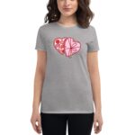 A gray t-shirt displays a graphic of two intertwined hearts filled with assorted candies and chocolates creating a playful design against a neutral background.