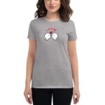 A woman wearing a gray t-shirt features a cute illustration of two cartoon birds kissing with hearts above them  set against a neutral background.