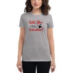 A woman wears a gray t-shirt that features the phrase "Will You Be My Valentine?" in red and black letters accompanied by a heart and arrow design.