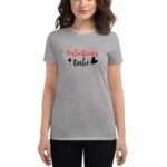 A woman wearing a gray t-shirt displays the text "Valentines Babe" in red and black with heart graphics  suggesting a festive or romantic context.