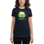 A woman wears a navy t-shirt featuring two beer mugs with foamy tops  text reads CHEERS!! HAPPY ST. PATRICK'S DAY  conveying a festive atmosphere associated with the holiday.