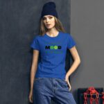 Young woman wearing a bright blue t-shirt with the word "MOOD" and two emoticons stands against a textured dark background with a red chain and box nearby.