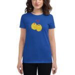 A woman wears a blue t-shirt featuring two smiling yellow lemons with blush marks and the text "OLIVE YOU" above them  blending a playful design with a casual fashion context.