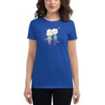 A blue t-shirt features a playful cartoon design of two characters with hearts around them showcasing a friendly connection in a casual setting worn by a young woman.